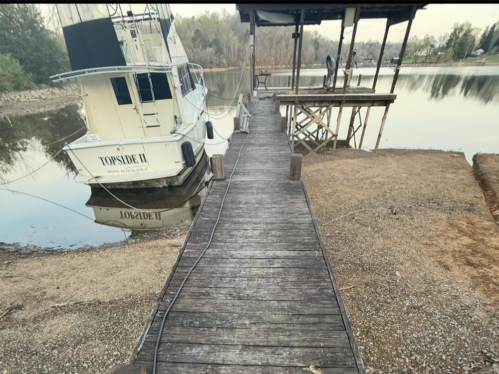 Weathered wood decking before pressure washing